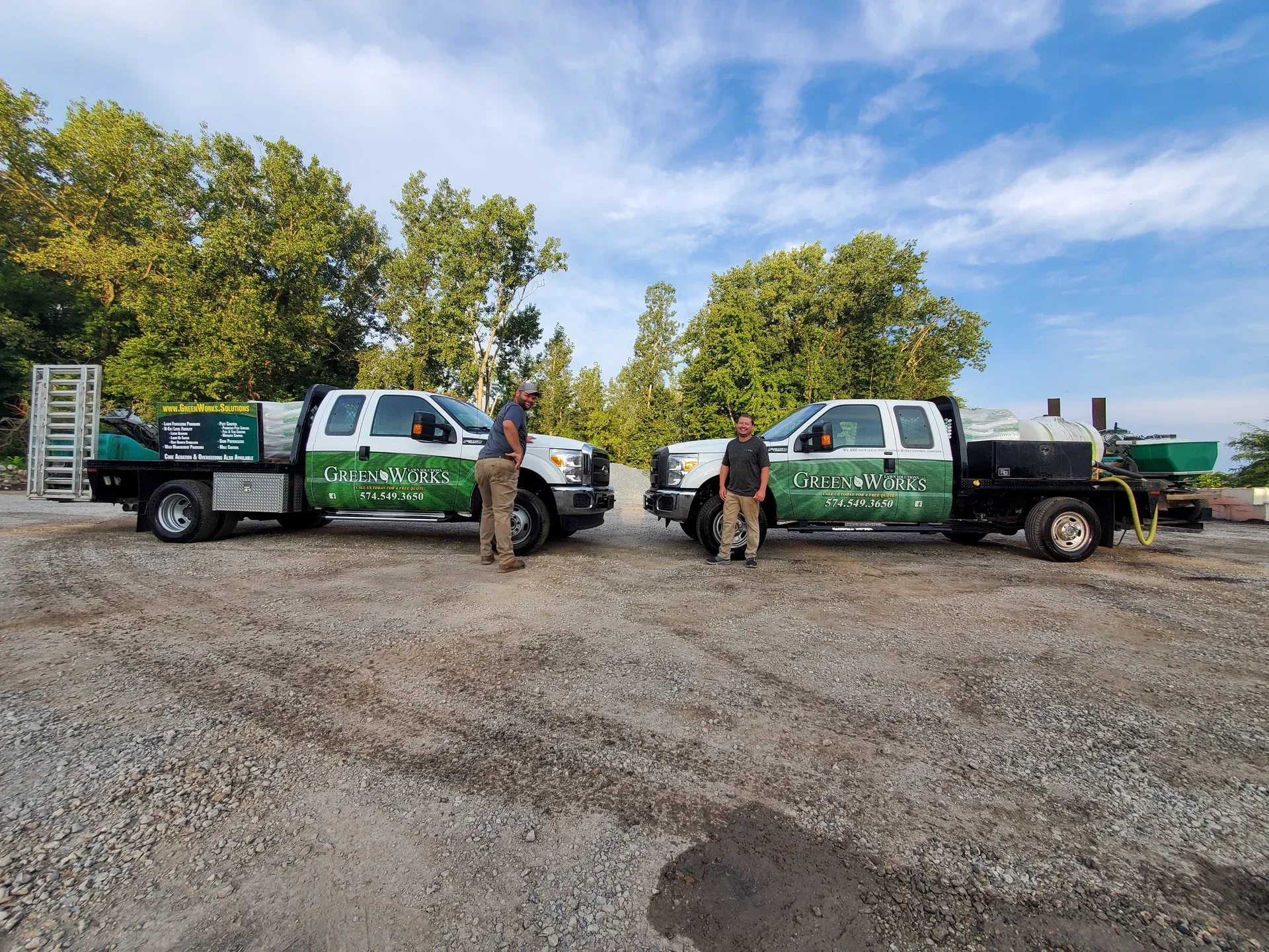 The GreenWorks Lawn Solutions crew standing with their trucks at the Pierceton shop