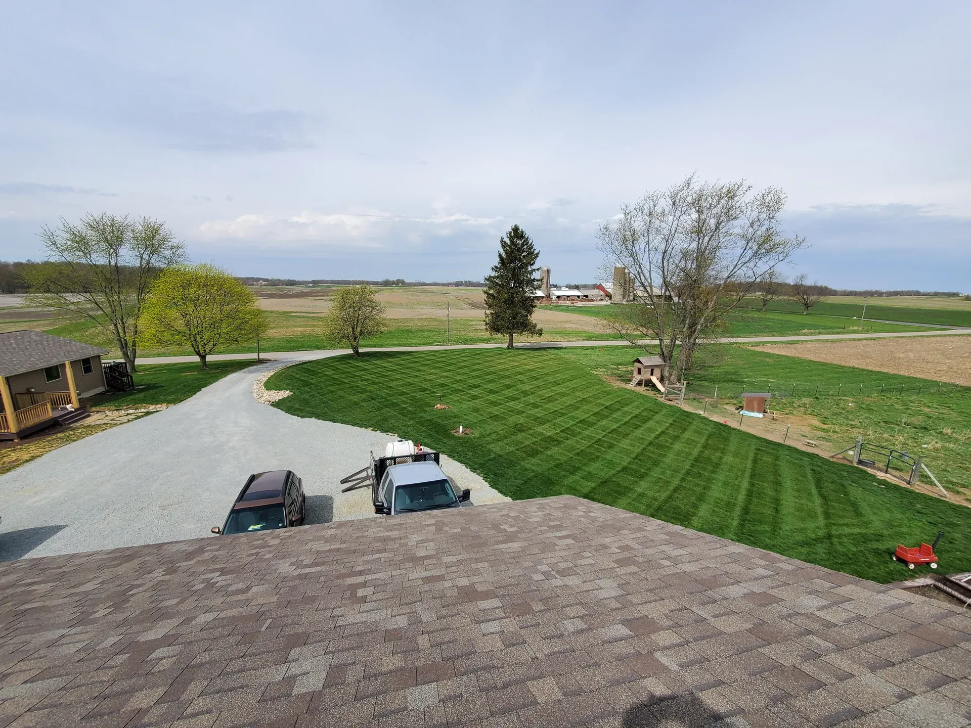 A striped, freshly treated lawn in front of a country home in northern Indiana